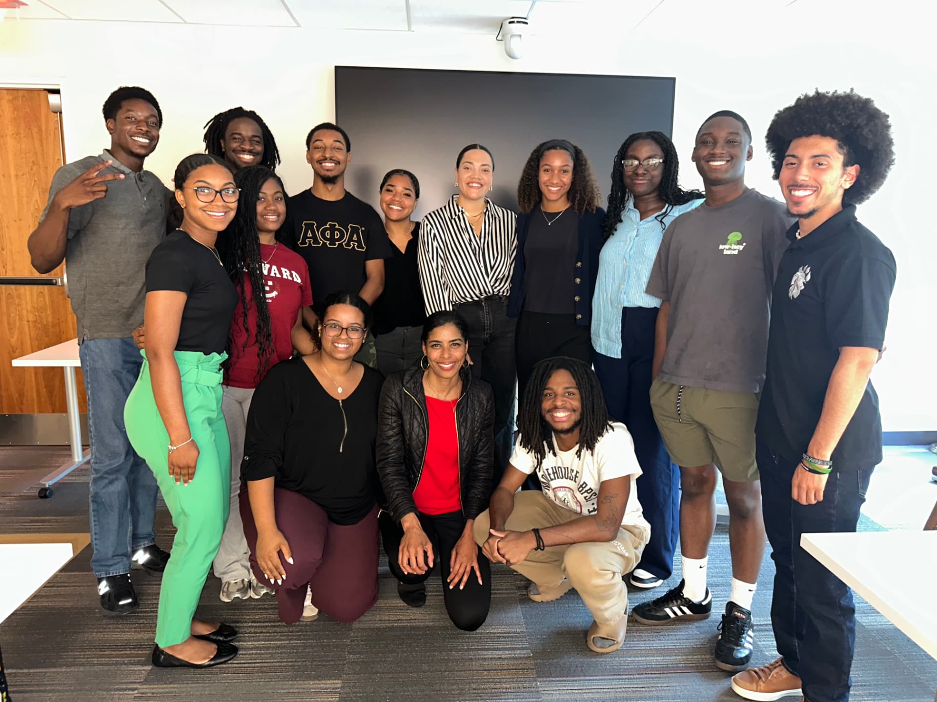 Tiana with students after a workshop